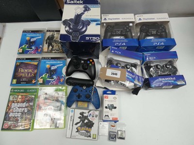 Lot 2040 - Bag containing gaming controllers and games