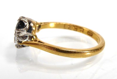 Lot An 18ct yellow gold ring set oval dark...