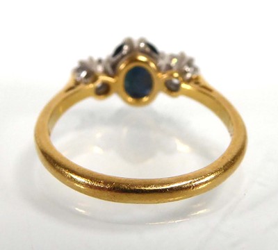 Lot An 18ct yellow gold ring set oval dark...