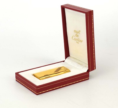 Lot 118 - A cased must de Cartier gold-plated lighter, 1989