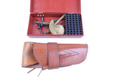 Lot 1047 - Leather holster and case of tooling