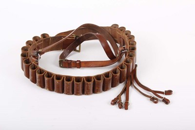 Lot 57 - 12-bore leather cartridge belt and game carrier