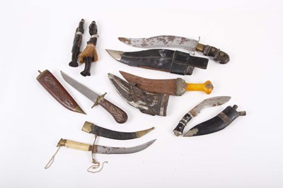 Lot 69 - Five various sheathed knives inc. kukri and...