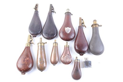 Lot 1003 - A collection of shot and powder flasks,...