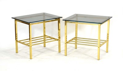 Lot 25 - A pair of 1970's brass side tables with later...