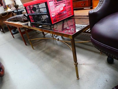 Lot 26 - A 1980's brass finished coffee table with a...