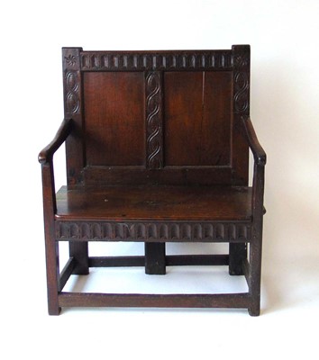 Lot 16 - An 18th century and later oak settle, with...