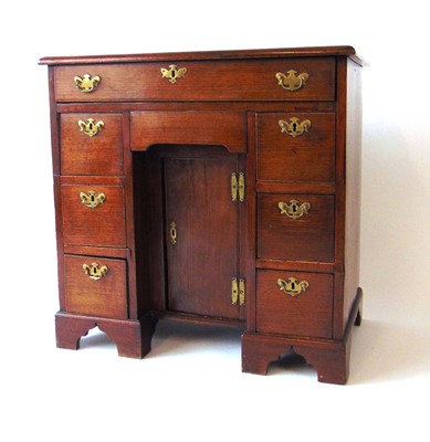 Lot 18 - An 18th century mahogany kneehole desk, with...
