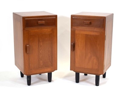 Lot 49 - A pair of 1950/60's solid teak bedside...
