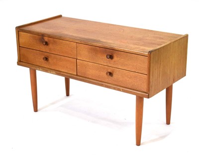 Lot 63 - A 1970's teak four-drawer chest on later...
