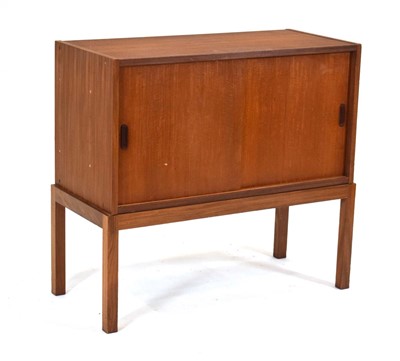 Lot 68 - A 1970's teak cabinet with two sliding doors...