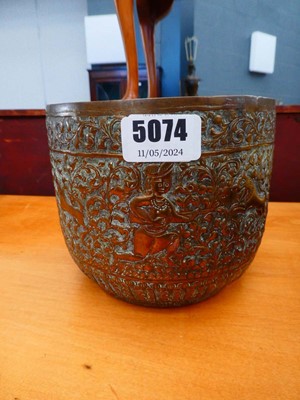 Lot 67 - A South East Asian brass bowl relief decorated...