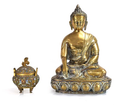 Lot 73 - A brass figure modelled as Shakyamuni Buddha,...
