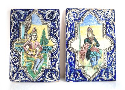 Lot 81 - A pair of enamelled plaques depicting...