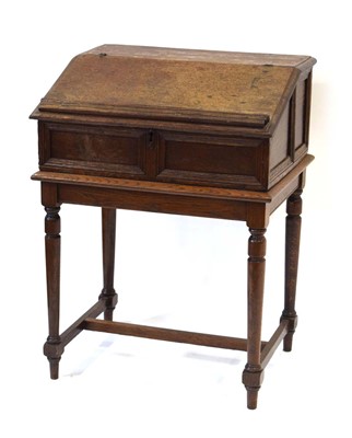 Lot 1 - An oak clerk's desk, the sloped surface...