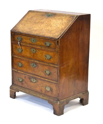 Lot 10 - A walnut and feather banded bureau of small...