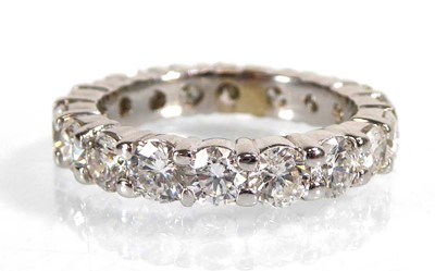 Lot 895 - A white metal full eternity ring set eighteen...