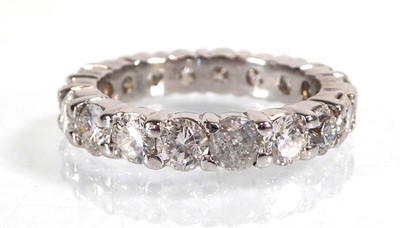 Lot 895 - A white metal full eternity ring set eighteen...