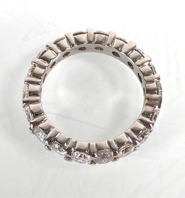 Lot 895 - A white metal full eternity ring set eighteen...