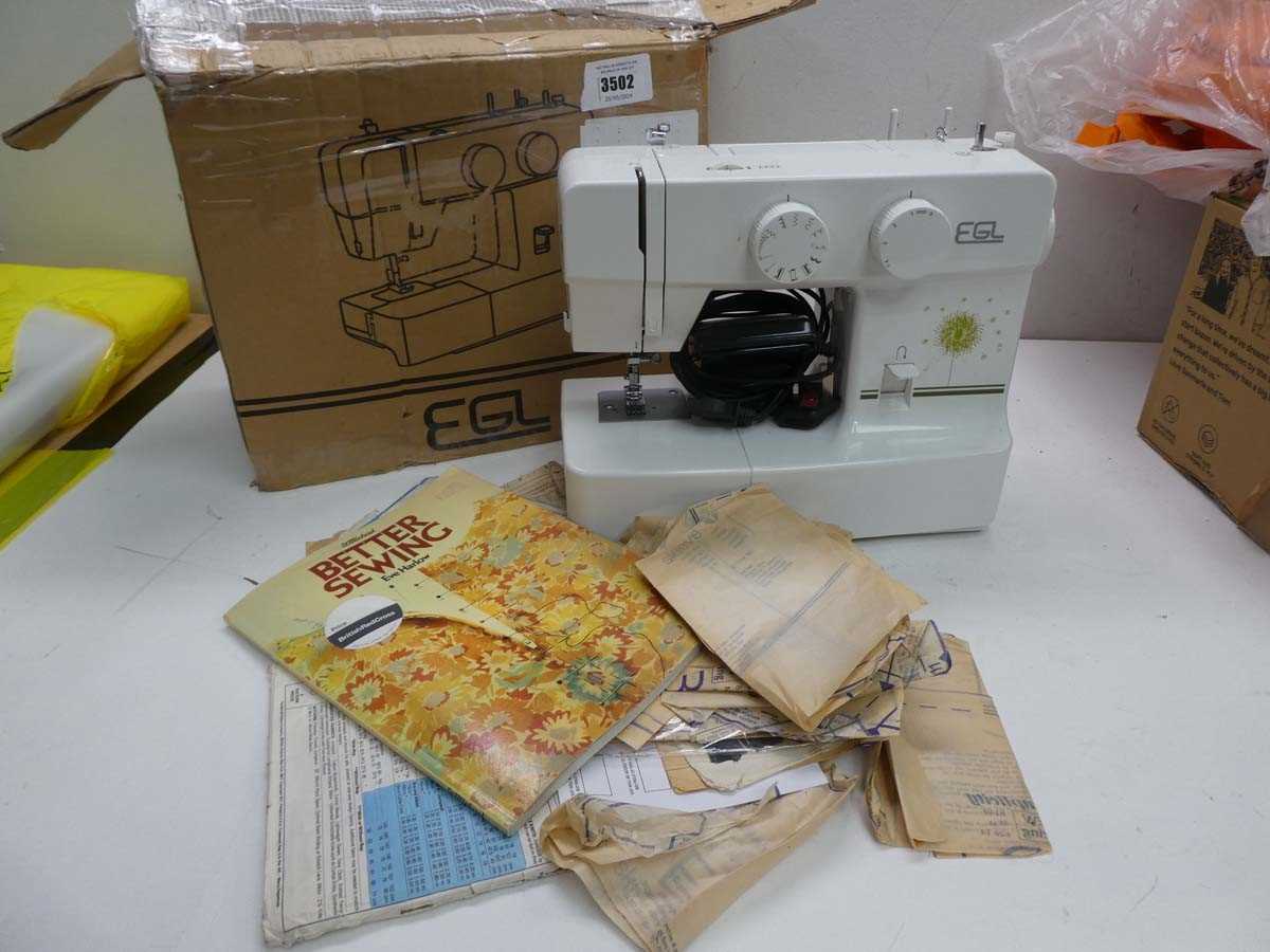 Lot 3502 EGL electric sewing machine and patterns