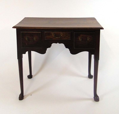 Lot 58 - A George III oak lowboy, the top with moulded...