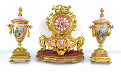 Lot 49 - A 19th century French clock and garnitures,...