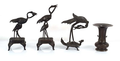 Lot 50 - A group of three Japanese brown patinated...