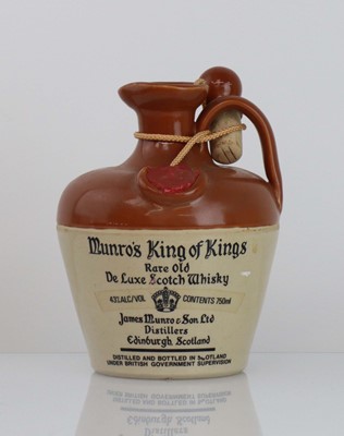Lot 13 - An old ceramic crock of Munro's King of Kings...