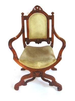 Lot 13 - A Victorian carved walnut X-frame 'Savonarola'...