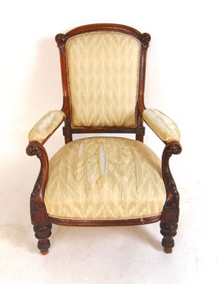 Lot 5 - A Victorian carved walnut open arm chair,...