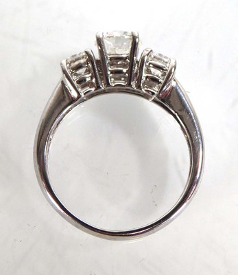 Lot 818 - An 18ct white gold ring set three graduated...