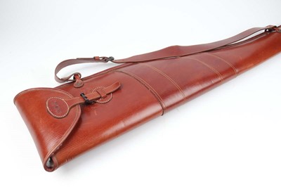 Lot 1032 - A Wildfowler's stout leather fleece-line gun...