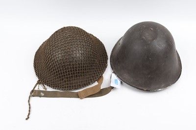 Lot 1037 - Two post-WWII British helmets