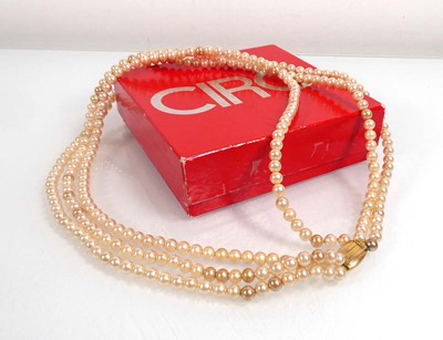 Lot A triple strand Ciro synthetic pearl necklace...