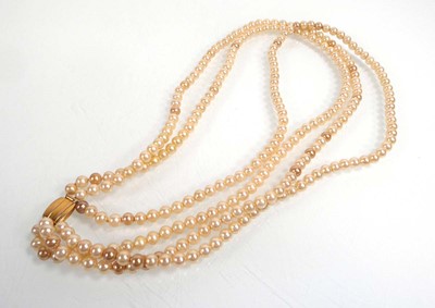 Lot A triple strand Ciro synthetic pearl necklace...