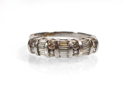 Lot An 18ct white gold ring set thirteen baguette...