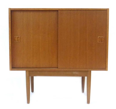 Lot 2 - A Danish teak cabinet with two sliding doors,...