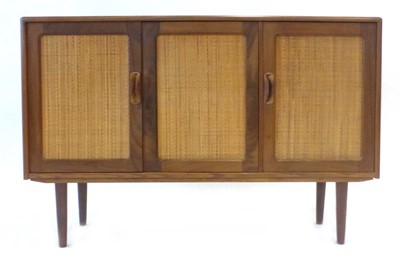 Lot 4 - A 1970's teak and crossbanded sideboard with...