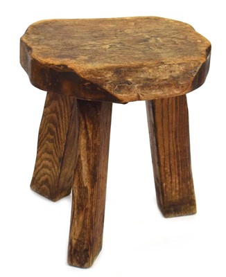 Lot 45 - A Wanderwood Furniture elm milking stool,...