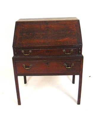 Lot 25 - A late 18th century oak lowboy or bureau, the...