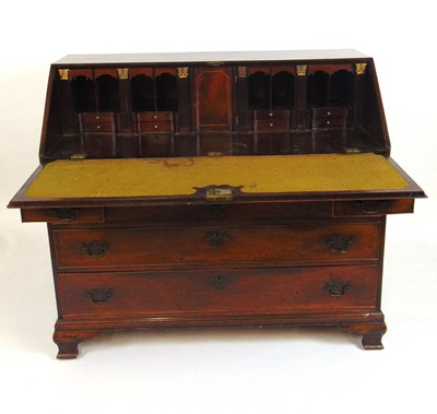 Lot 29 - A George III mahogany bureau, the fall front...