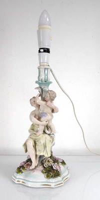 Lot 317 - A Sitzendorf figural lamp base modelled as a...