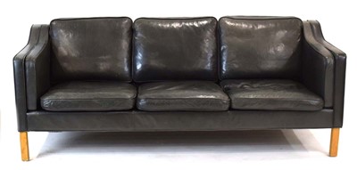 Lot 28 - A Danish black leather three-seater sofa by...