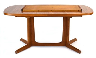 Lot 74 - A Danish teak and crossbanded extending dining...
