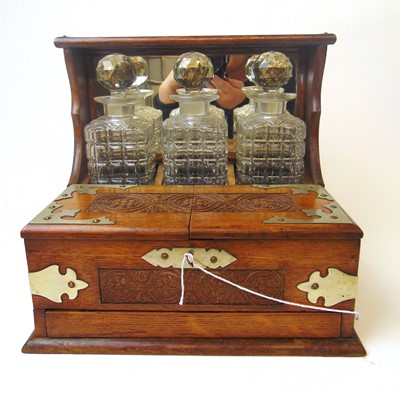 Lot 254 - An early 20th century oak and metalwares...