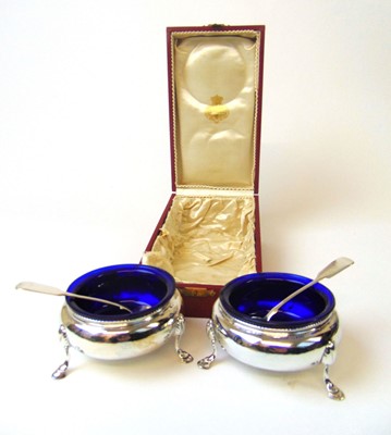 Lot 404 - A cased pair of Victorian silver salts with...