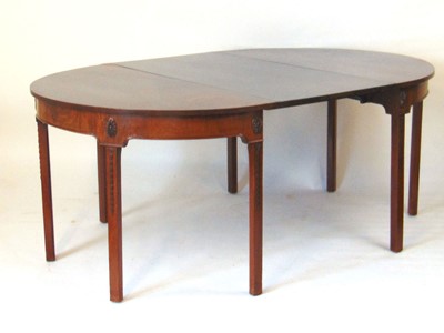 Lot 40 - A Georgian mahogany dining table, the pair of...