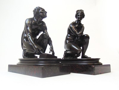 Lot 266 - A pair of brown-patinated bronze figures...