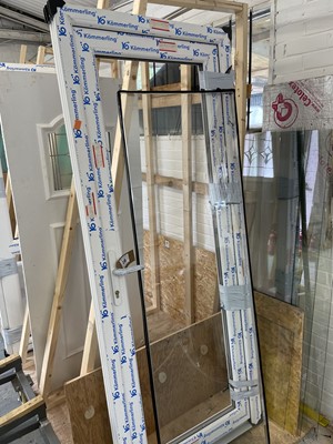 Lot 16 - White PVCu door and frame with single glazed...