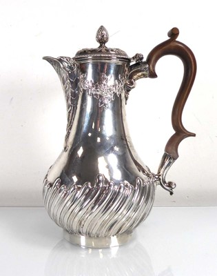 Lot 401 - A George III silver hot water pot, the spout...